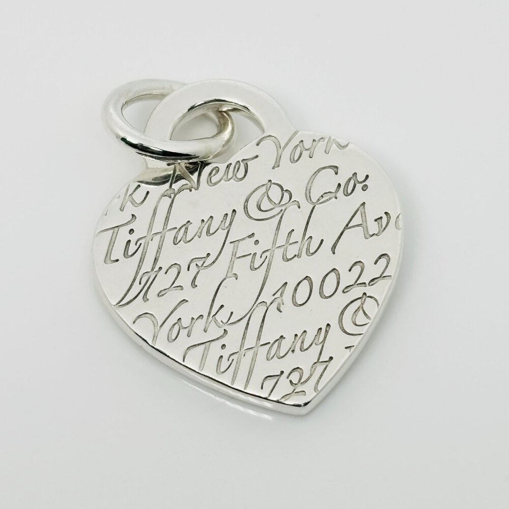 Tiffany & Co Notes 727 Fifth Ave Wave Herat Pendant or Charm in Sterling Silver